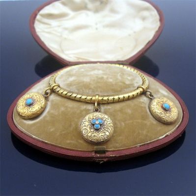 Appraisal: A Victorian gold bracelet with three locket pendants the gold