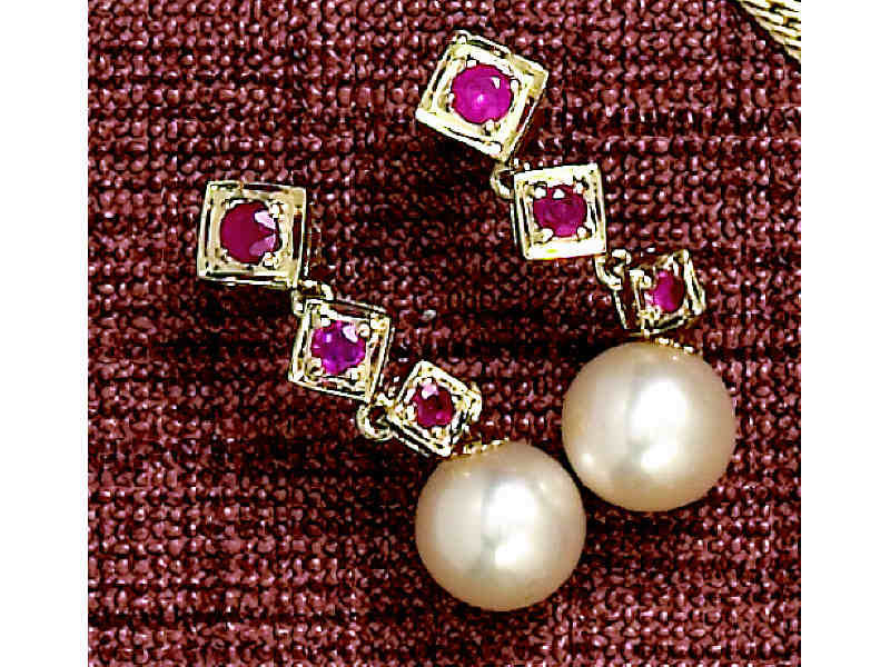 Appraisal: PEARL AND RUBY EARRINGS Kk yellow gold dangling pierced earrings