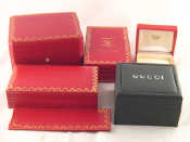 Appraisal: Four Cartier and one Gucci jewellery watch perfume boxes and