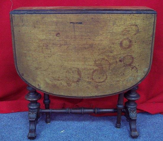 Appraisal: A Victorian walnut Sutherland table the two rounded flaps on