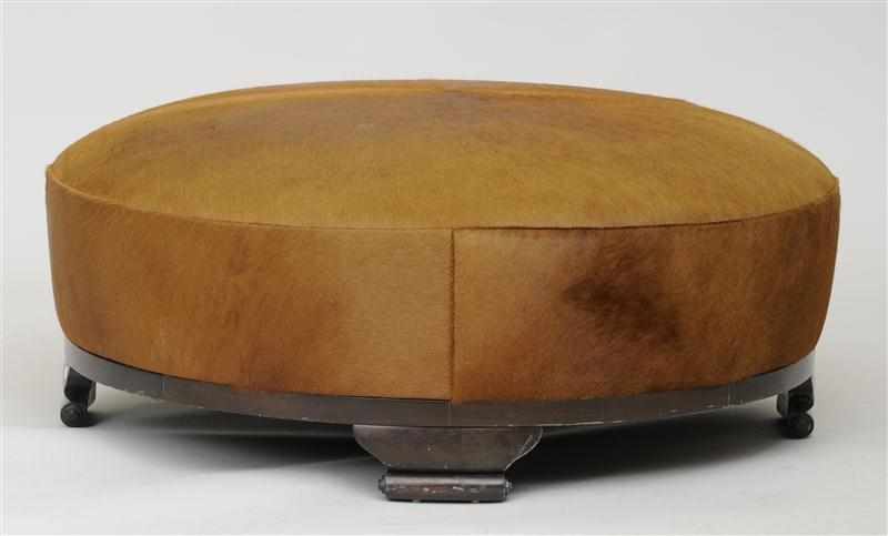 Appraisal: MODERN CALF SKIN AND EBONIZED OTTOMAN Of typical form raised