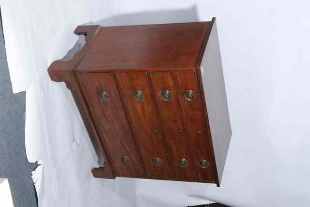 Appraisal: A GEORGE III MAHOGANY CHEST of four long drawers with