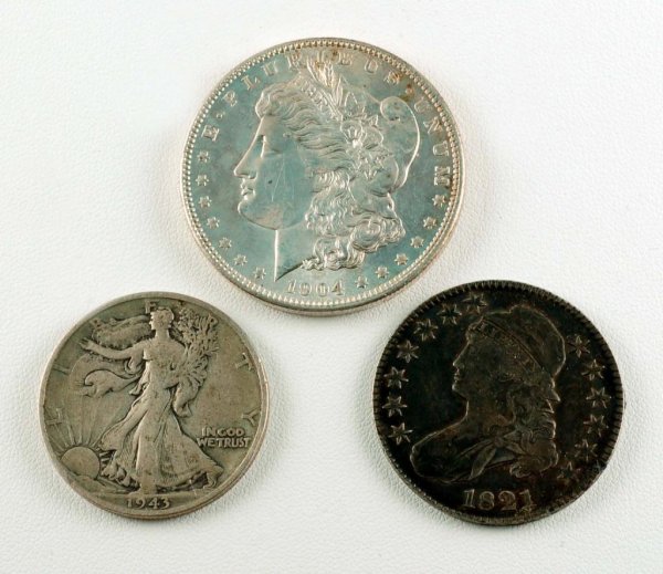 Appraisal: Lot of three silver coins Includes a -O Morgan silver