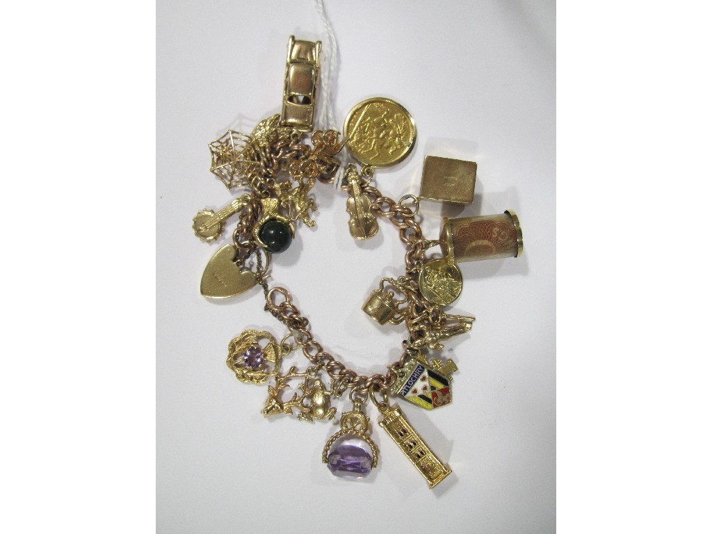 Appraisal: Nine carat gold charm bracelet with various gold charms to