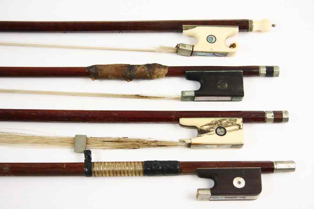 Appraisal: VIOLIN BOWS - Including unmarked ivory and silver fitted one