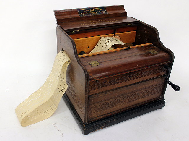 Appraisal: AN ARISTON ORGANETTE with an ebonised case and winding handle