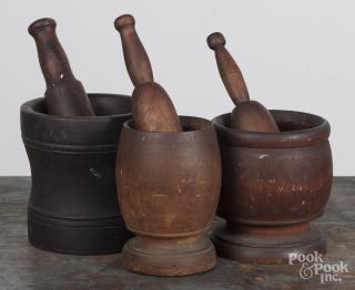 Appraisal: Three turned wood mortar and pestles th th c approximately