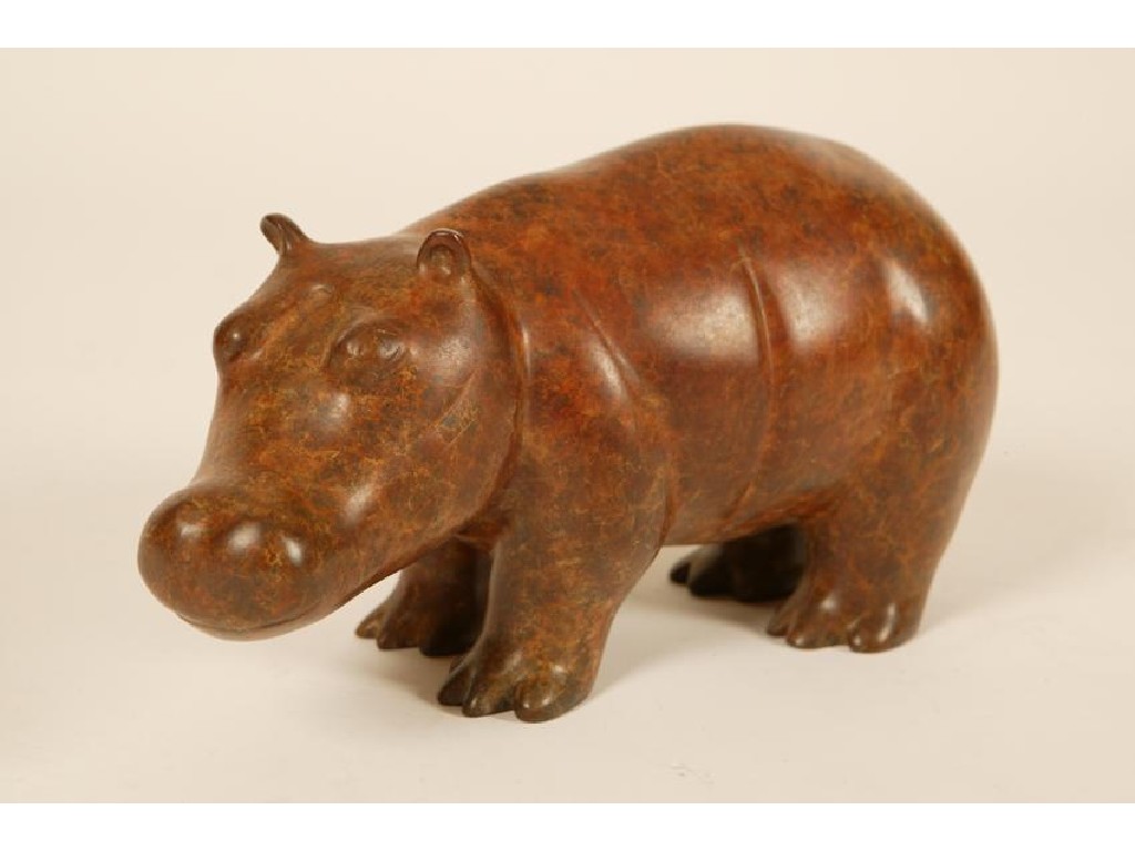 Appraisal: A BRONZE OF A HIPPOPOTAMUS with mottled patination high -