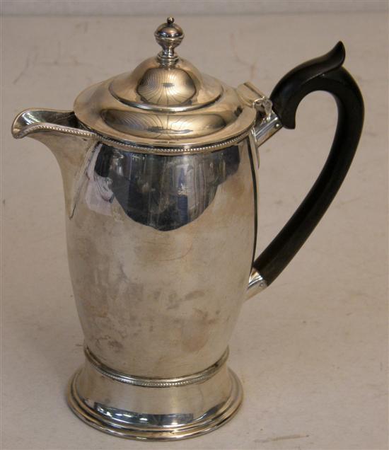 Appraisal: George V silver hot water jug with ebonised handle London