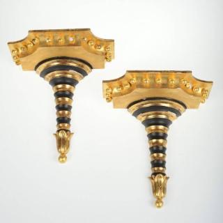 Appraisal: Pair Regency style gilt black wall brackets th th c