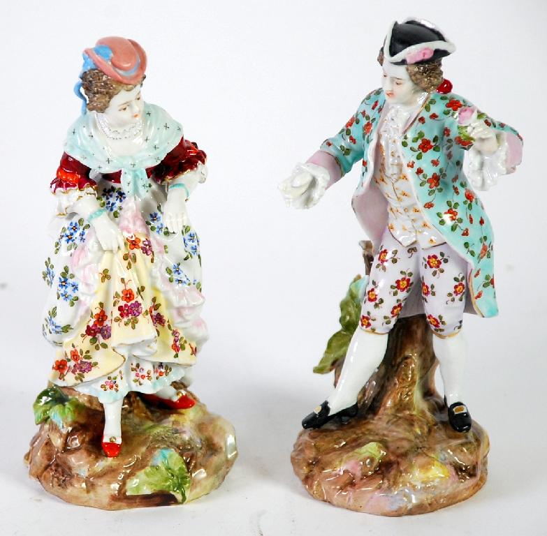 Appraisal: PAIR OF SITZENDORF PORCELAIN FIGURES polychrome painted and modelled as