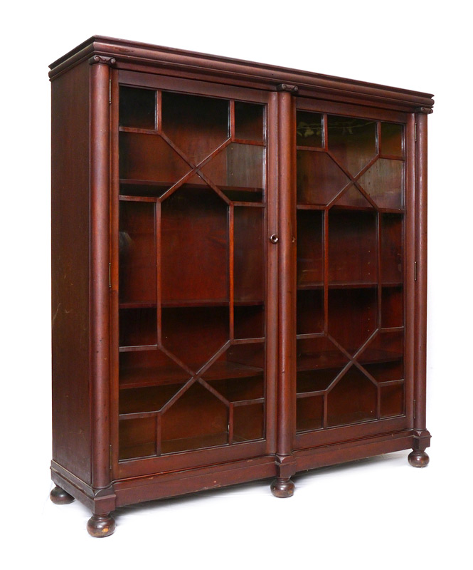 Appraisal: MAHOGANY BOOKCASE Double glass doors with fretwork each side with