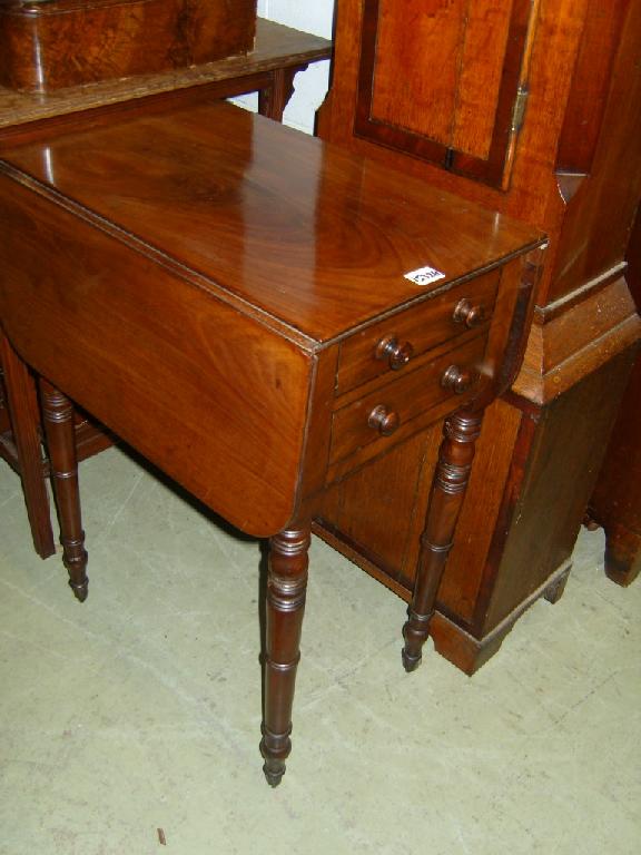 Appraisal: A small Regency mahogany drop leaf ladies sewing table with