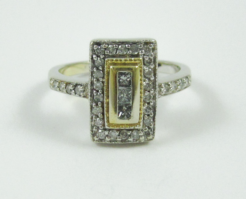 Appraisal: DIAMOND AND FOURTEEN KARAT GOLD RING The white and yellow