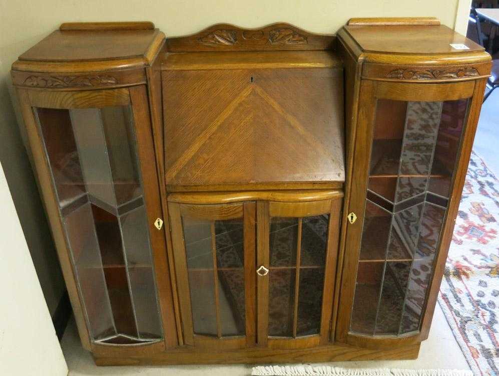 Appraisal: AN OAK SECRETARY BOOKCASE English early th century the slant-front