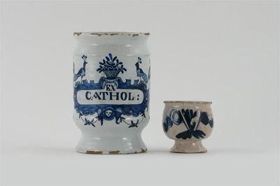 Appraisal: A delftware ointment pot painted in blue with a stylized