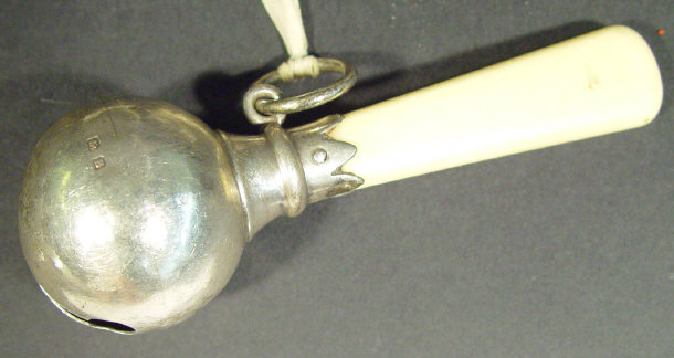 Appraisal: Globular silver child's rattle with bone handle Birmingham cm in