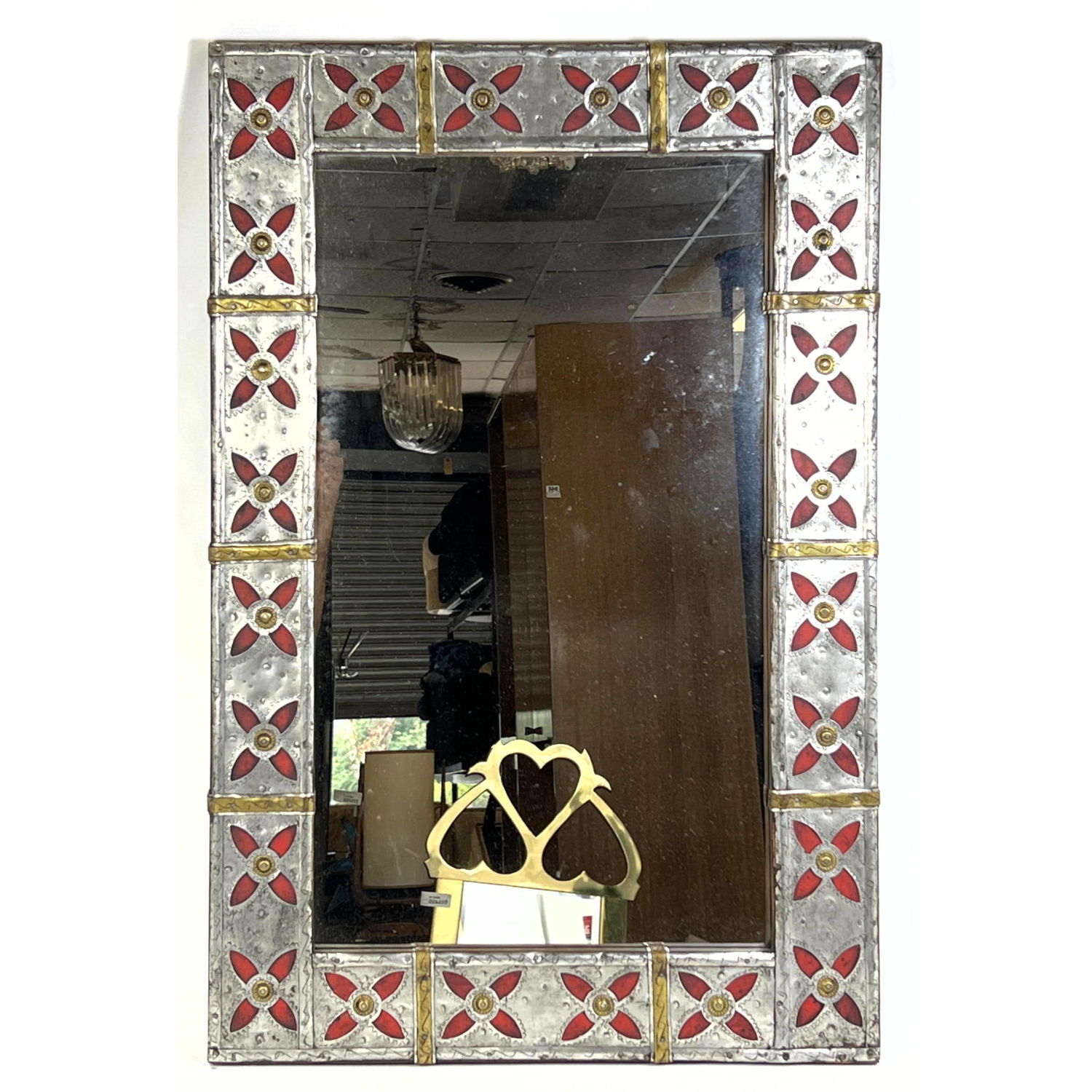 Appraisal: Punched Tin Framed Wall Mirror Red and brass accents Wood