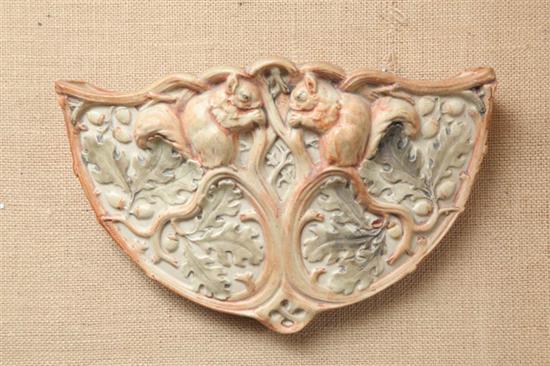 Appraisal: WELLER WALL POCKET In the Woodcraft pattern Facing squirrels amongst