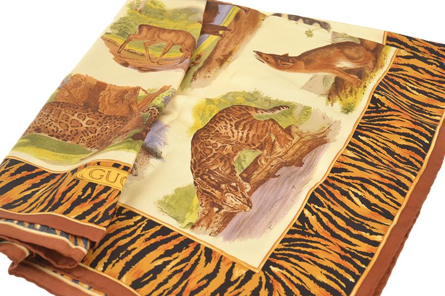 Appraisal: A SILK SCARF BY GUCCI Styled with assorted wild animals