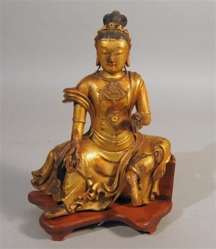 Appraisal: Chinese giltwood Quanyin model Depicting the goddess in a seated