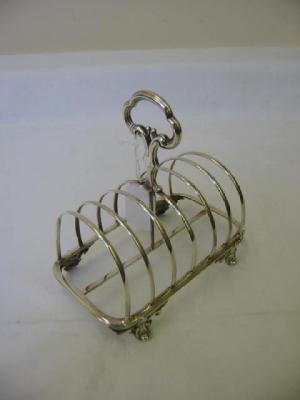 Appraisal: A VICTORIAN TOAST RACK of rounded oblong form with seven