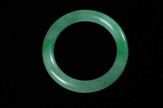 Appraisal: CHINESE APPLE GREEN JADEITE BANGLE - Interior in diam