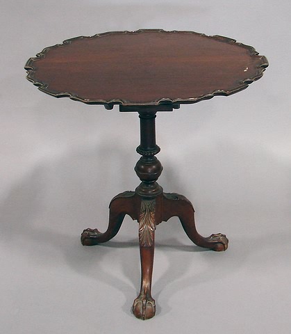 Appraisal: Mahogany with deeply molded piecrust edge ringed ball pedestal on