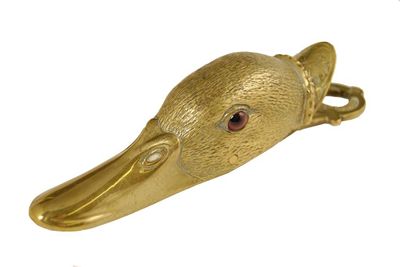 Appraisal: A parcel gilt bronze 'cormorant head' clip with bead eyes