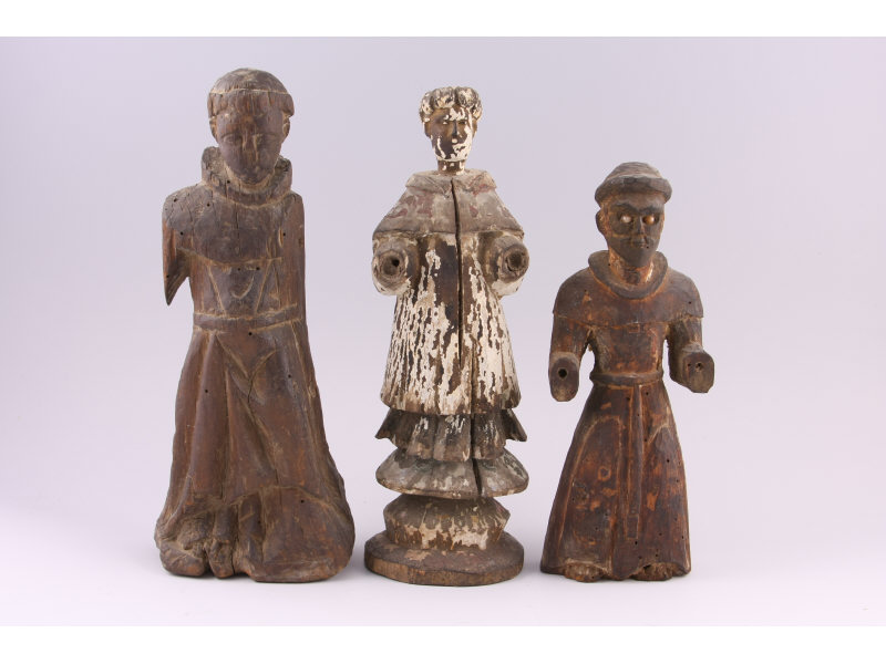 Appraisal: Three Antique Carved Wooden Santos Figures likely from Latin America