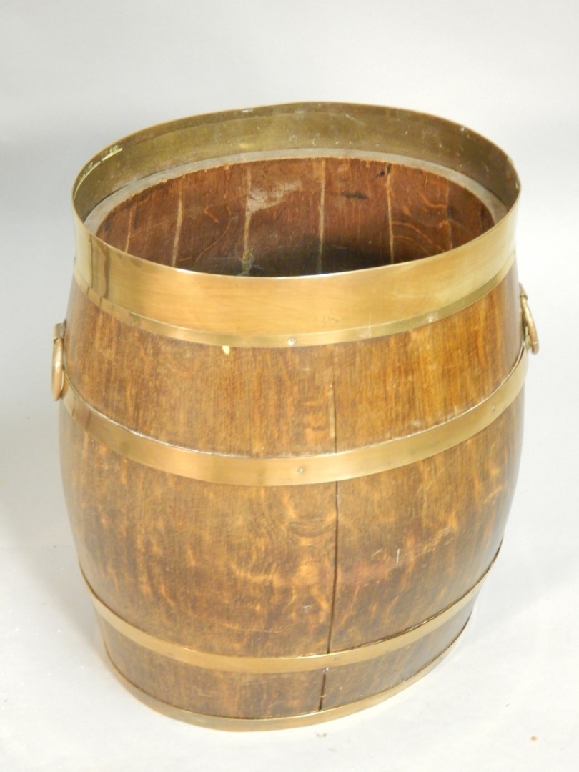 Appraisal: An oak and brass coopered umbrella or waste paper basket