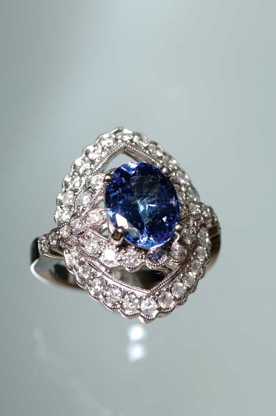 Appraisal: TANZANITE AND DIAMOND RING Edwardian-style tanzanite and diamond K white