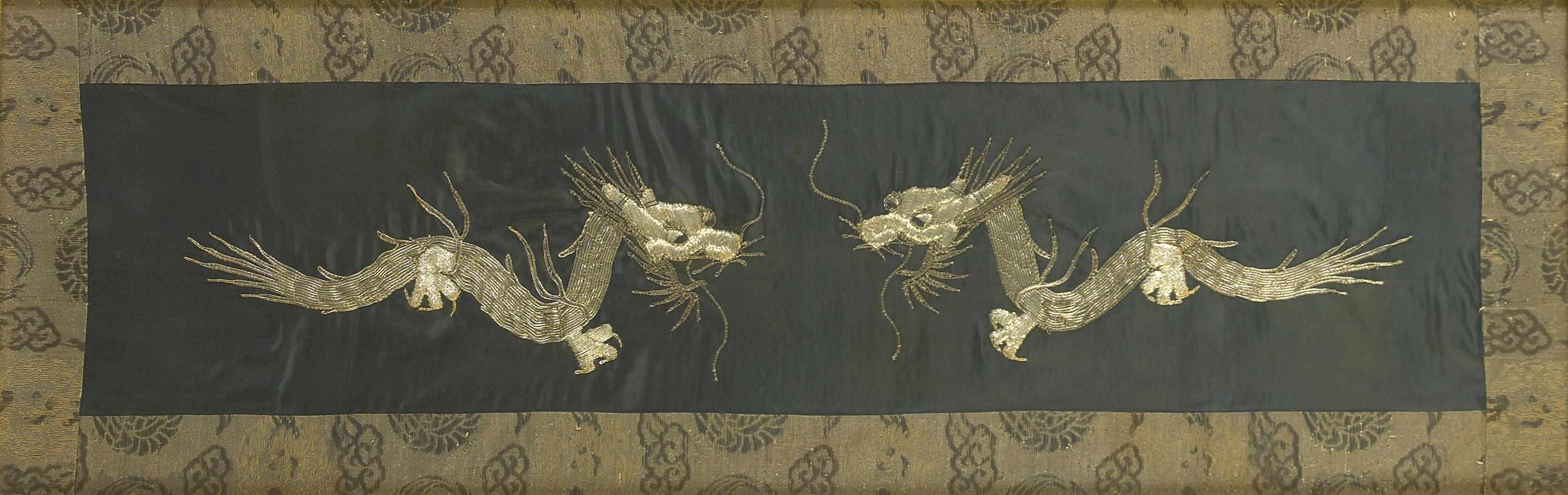 Appraisal: A Chinese framed embroidery of a pair of dragons in