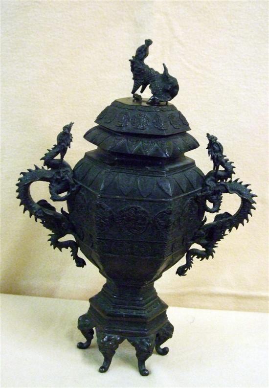 Appraisal: A CHINESE BRONZE BALUSTER VASE on six scroll feet with