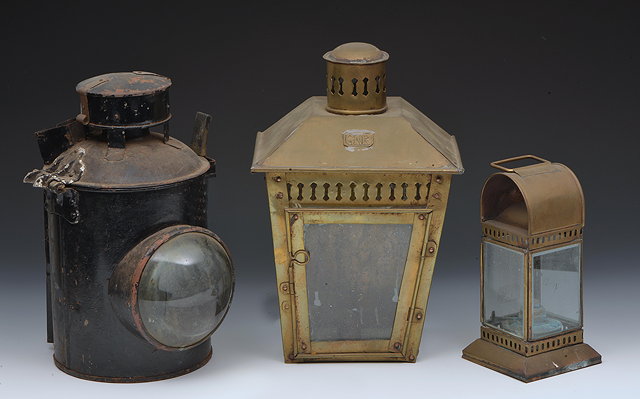 Appraisal: A BRASS STATION-TYPE THREE-GLASS LANTERN with tapering sides and labelled