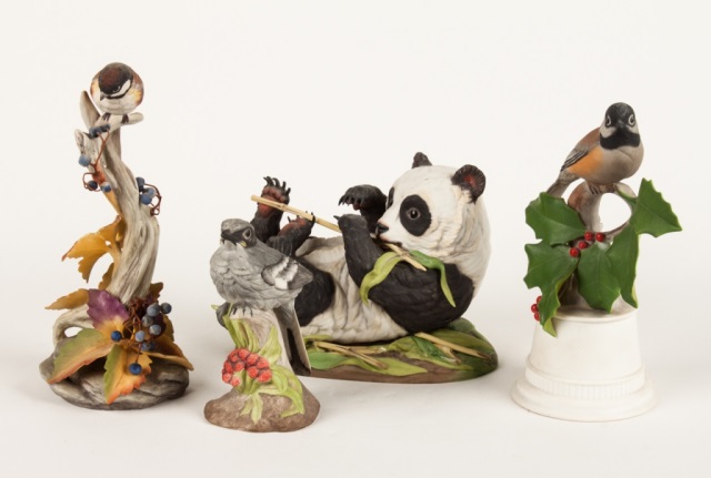 Appraisal: Three Boehm birds and a panda cub painted bisque figures