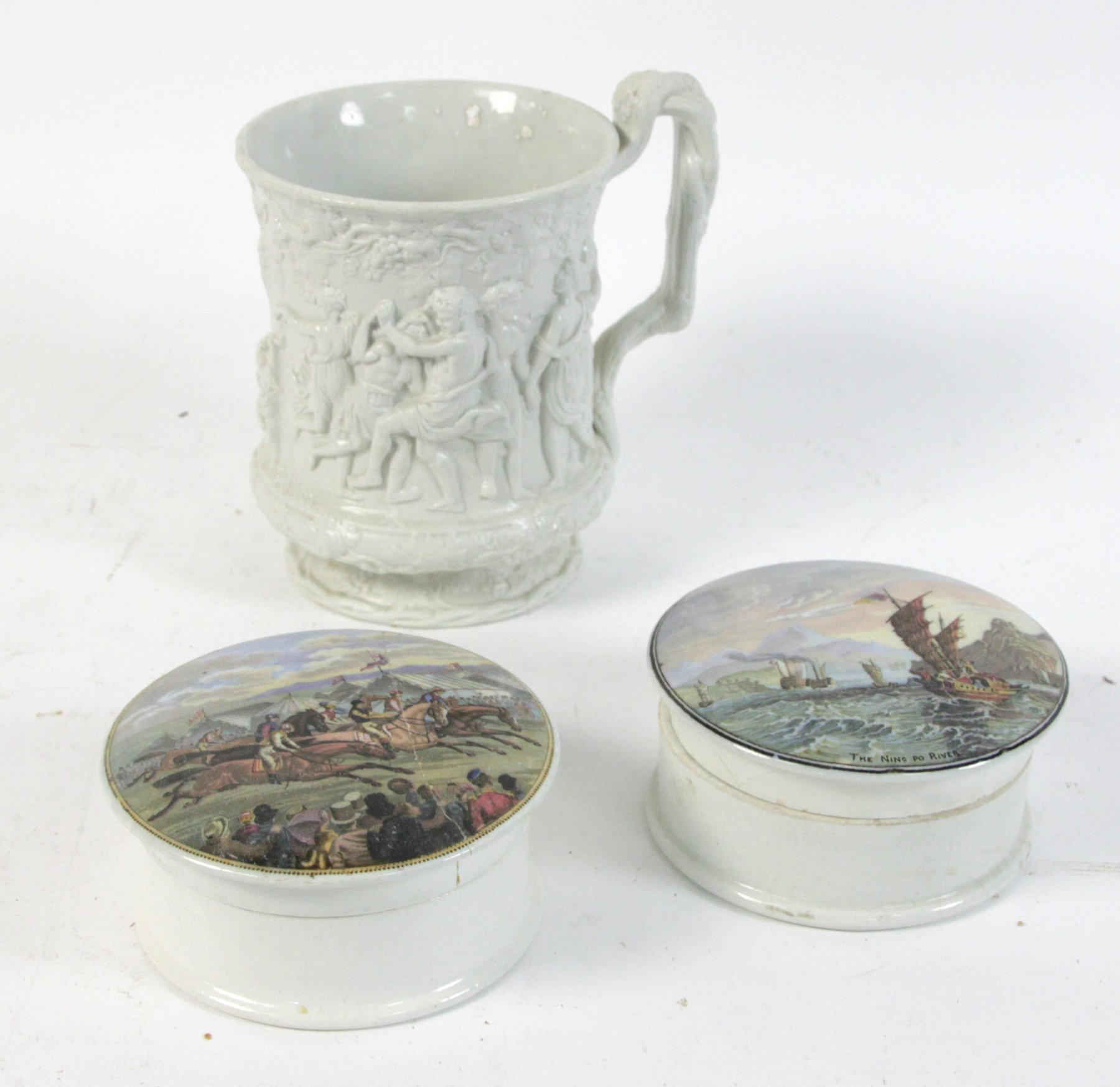 Appraisal: A Charles Meigh relief moulded mug decorated a bacchanal scene