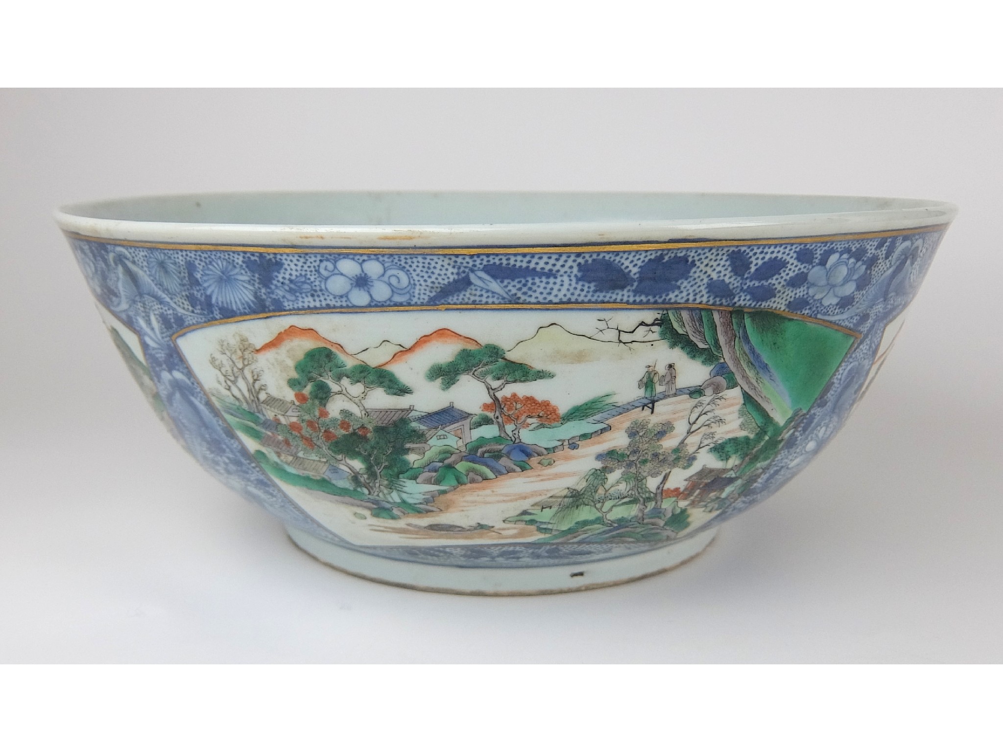 Appraisal: A Chinese punch bowlpainted with four fan shaped landscape panels