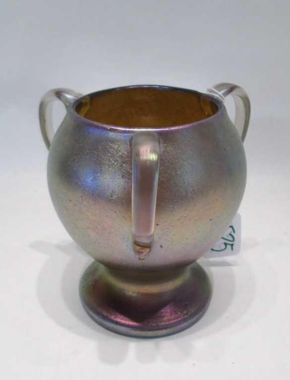 Appraisal: FOUR ART GLASS TABLEWARE ITEMS iridescent footed loving cup with