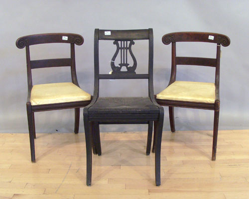 Appraisal: Three saber leg dining chairs together with a Sheraton games