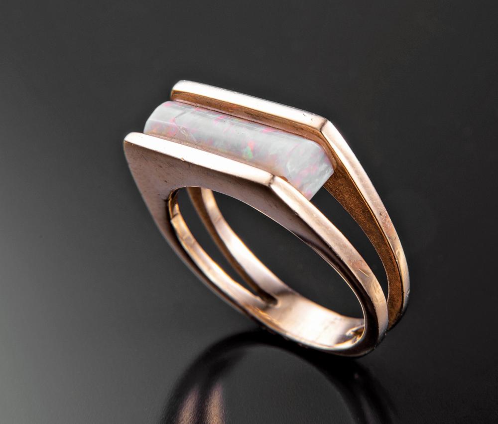 Appraisal: kt Yellow Gold and Precious Opal Channel Set Saddle Ring