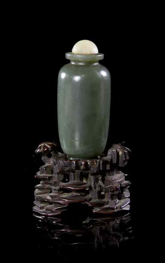 Appraisal: A Hardstone Snuff Bottle of deep spinach green colored stone