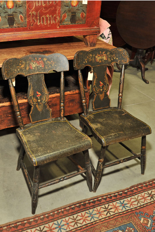 Appraisal: FOUR EARLY SIDECHAIRS Black painted and stencil decorated chairs depicting