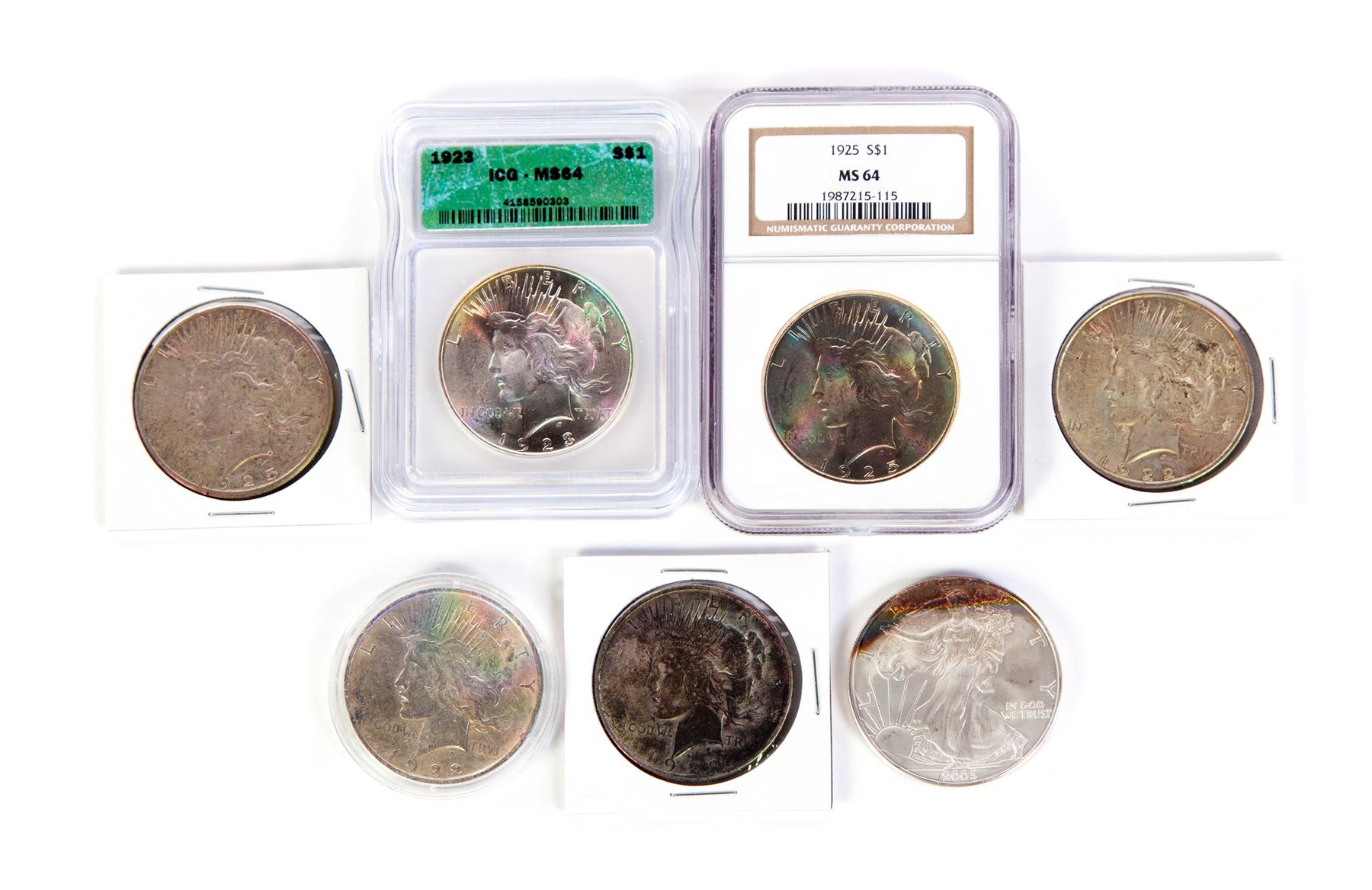 Appraisal: SEVEN SILVER DOLLARS Six Peace two graded MS American Silver