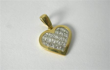 Appraisal: A heart shaped diamond set pendant invisibly set with princess