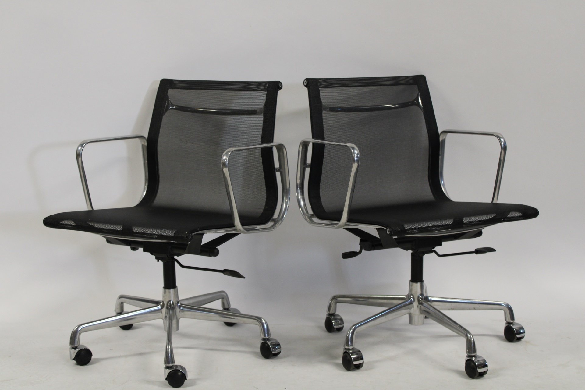 Appraisal: A PR OF EAMES STYLE CERENE MESH CHAIRS From an