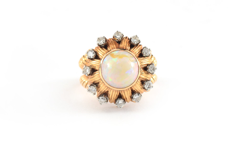 Appraisal: K OPAL DIAMOND RING k yellow gold ring centering a