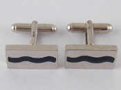 Appraisal: A pair of stone set silver cufflinks each side approx