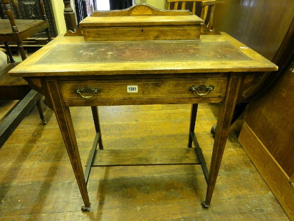 Appraisal: An inlaid Edwardian writing table the shallow raised back incorporating