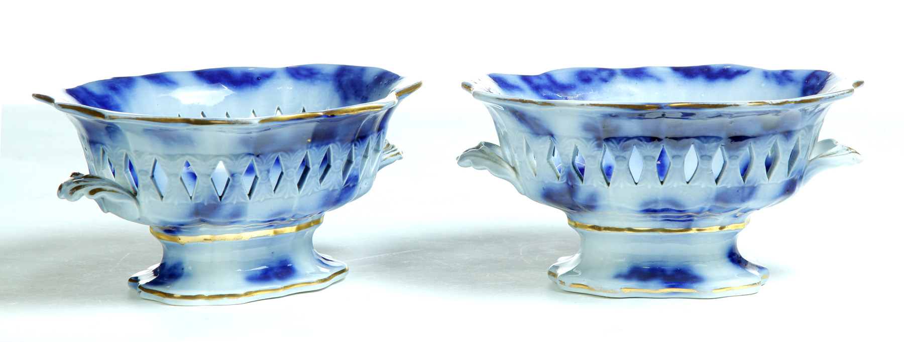 Appraisal: PAIR OF FLOW BLUE COMPOTES England rd quarter- th century